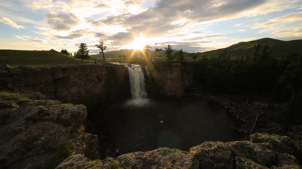 Sunset Over Waterfall Ulaan Tsutgalan, Mongolia.  Timelapse