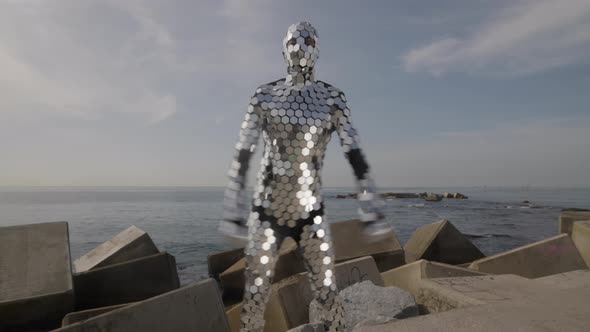 Sparkling Discosuit Man Dancing Next to the Sea