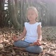 Little Child Girl Meditating Alone Under Banyan Tree - VideoHive Item for Sale