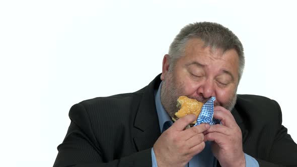 Close Up Overweight Businessman Enjoying Hamburger