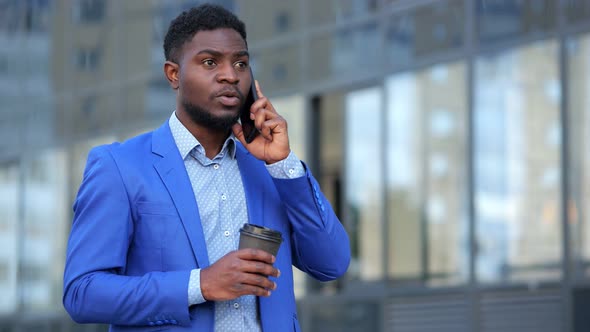 African American Man at Break From Office Chaos with Coffee