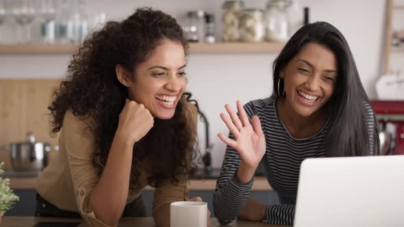 Zoom out video of women during a video conference at home.  Shot with RED helium camera in 8K.