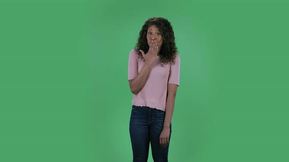 Portrait of Beautiful African American Young Confused Women Is Looking at Camera Saying Oops 