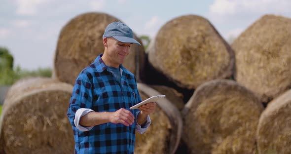 Midsection of Male Researcher Using Digital Tablet