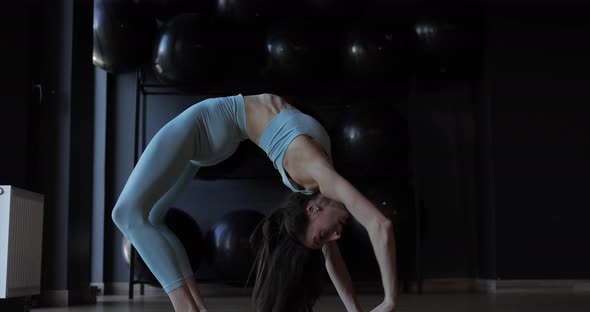 Flexible Gymnast Woman Doing Backbend