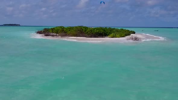 Aerial drone landscape of island beach break by lagoon and sand background