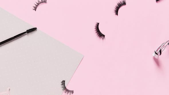 Stop Motion  Video with False Eyelashes and Accessories on Pink Background