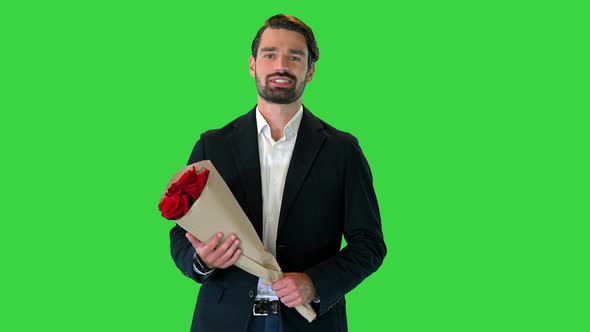 Elegant Man Walking with Bouquet of Red Roses on a Green Screen Chroma Key