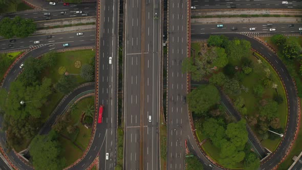 Aerial Ascending Birds Eye Close Up Overhead Top Down View of Multiple Vehicles on a Multi Lane Road