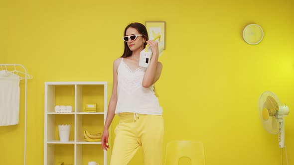 Young Woman Is Listening Music On Retro Recorder