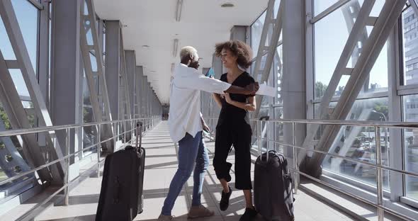 African Successful Young Man Giving Travel Tickets To Woman Wife, Mixed Race Guy Showing Happy