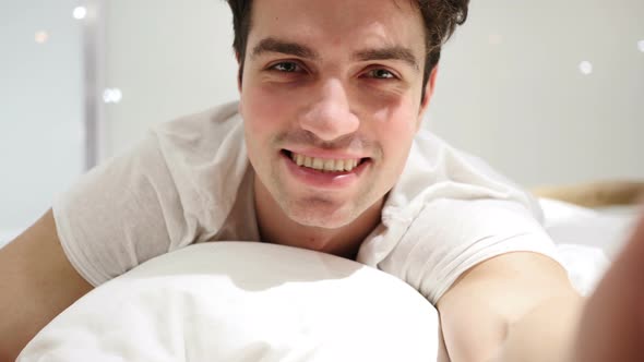 Gesture of Yes by Man Lying in Bed