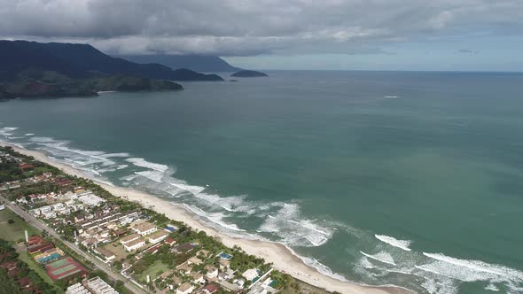 Brazilian Maresias beach landmark. Tropical summer beach.