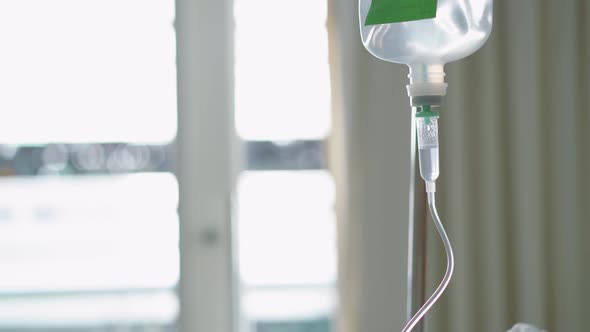 Close up saline drip or saline transfusion for patient and Infusion pump in hospital or clinic
