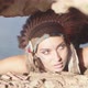 Ethnic Wonderful Woman with Native American Headdress and Ornament Hiding in Rocks Hunting Eyes - VideoHive Item for Sale