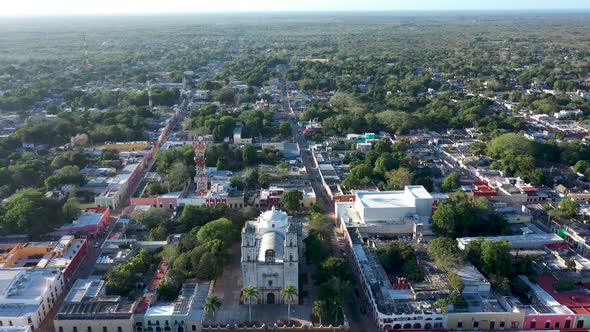 High aerial push in and fly over the Cathedral de San Gervasio in Valladolid, Yucatan, Mexico.