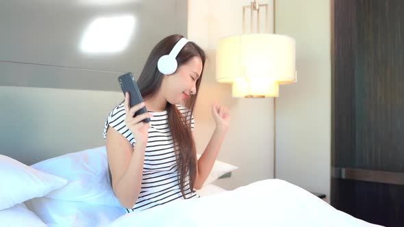 Woman use smart phone for listen music