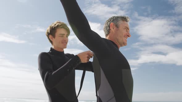 Father and young adult son enjoying outdoor activities together