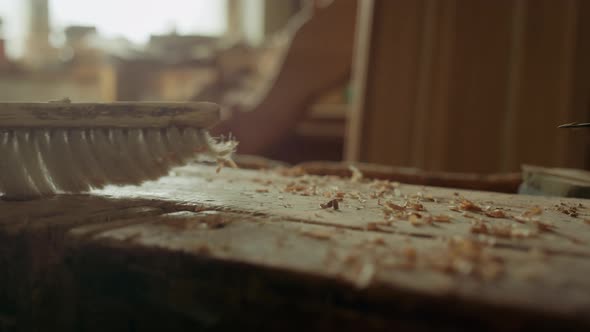 Man Exempting From Sawdust Indoors