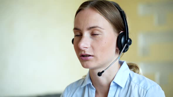 Businesswoman Talking on the Phone While Working on Her Computer at the Office. Call Сenter Agent