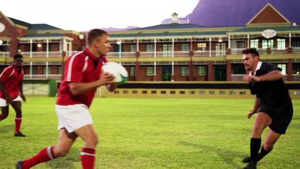 Male rugby players playing rugby in the stadium 4k