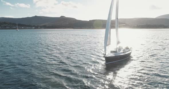 Closeup of Sail Boat at Ocean Gulf Aerial