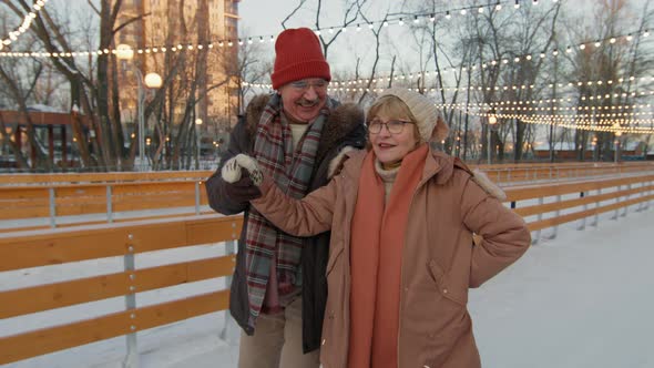 Senior Couple Skating At Sunset