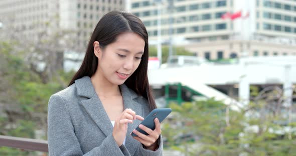 Woman use of cellphone for online at outdoor