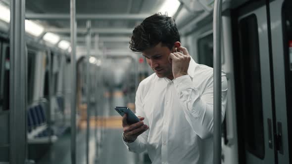 Businessman Using Smartphone in Train