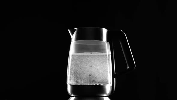 Turn on the Electric Kettle, It Boils. Black Background