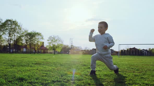 The Boy Hits the Ball on Goal