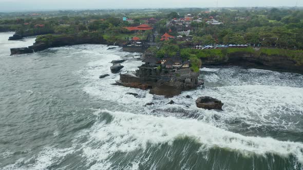 Wide Panoramic View of Tanah Lot Temple in Dangerous Sea