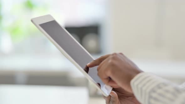 Hands Close Up of African Man Working on Tablet