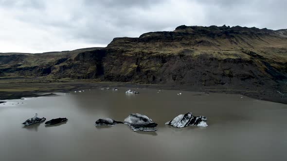 Iceland Icebergs with green moss covered mountain