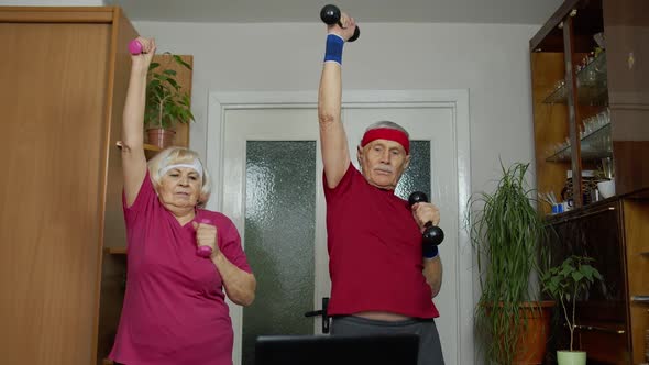 Mature Couple Man and Woman Fitness Trainer Coach Records Video Online Workout Exercises Course