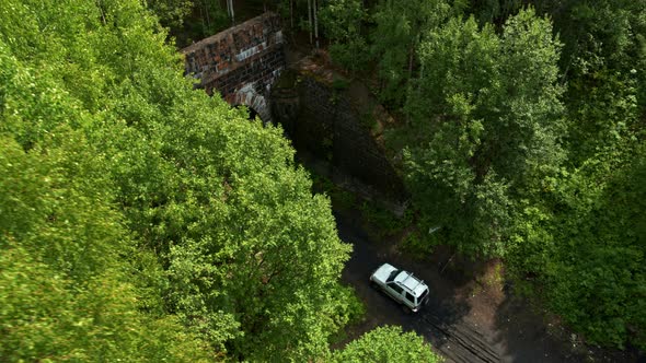 Aerial View of the Car Entering the Tunnel