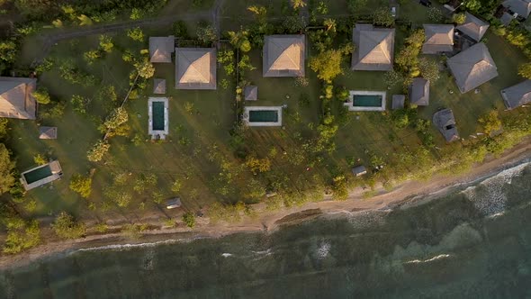 Aerial view above of luxury bungalows, Bali island, Indonesia.