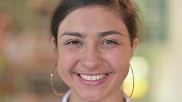 Close Up of Face of Smiling Young Indian Woman 