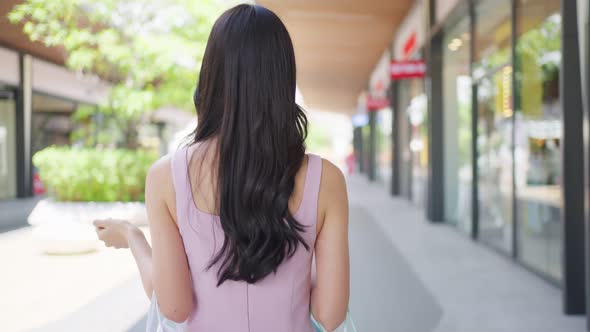 Portrait of Asian attractive girl shopping outdoor in department store.