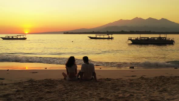 Romantic couple engaged on paradise bay beach time by aqua blue ocean and white sandy background of 