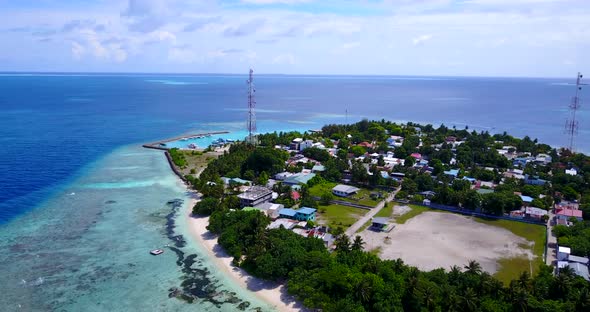 Daytime birds eye clean view of a summer white paradise sand beach and turquoise sea background in c