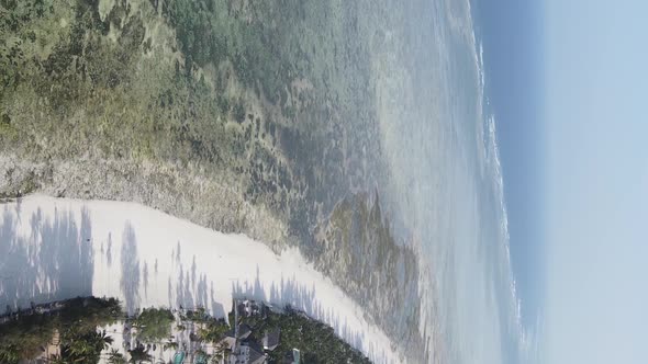 Vertical Video of the Ocean Near the Coast of Zanzibar Tanzania Aerial View