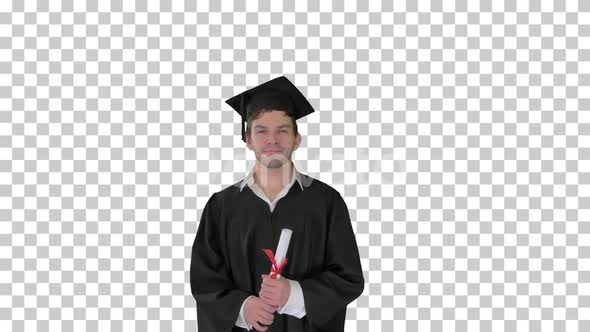 Male graduation student smiling and tossing up his hat