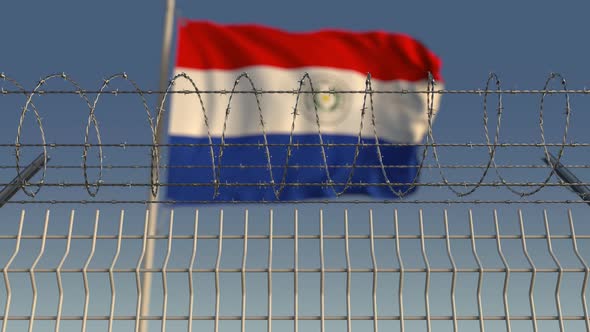 Flag of Paraguay Behind Barbed Wire