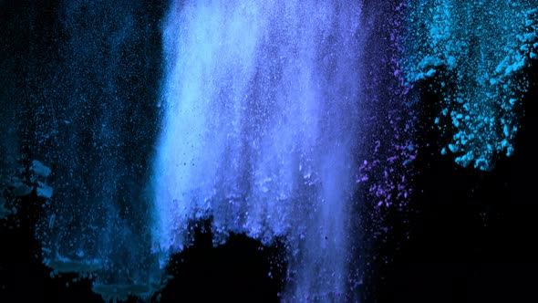 Super Slowmotion Shot of Color Powder Waterfall Isolated on Black Background