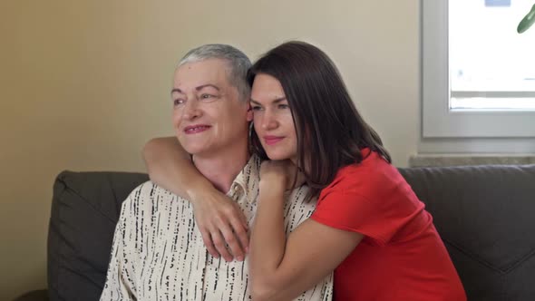 An Adult Daughter Hugs Her Mother