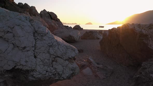 Rocky Island Beach with Boat on the Horizon