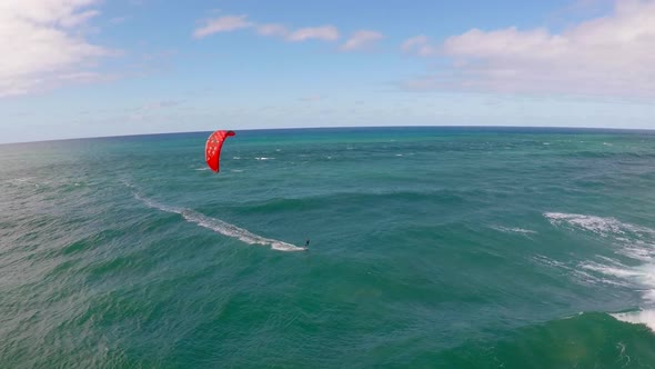 Aerial view of a man kitesurfing in Hawaii