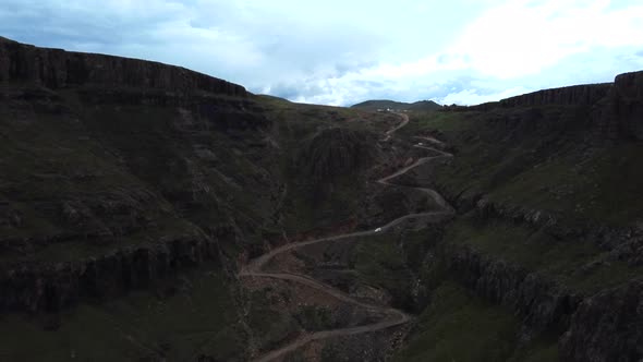 Drone shot of Drakensberg in South Africa - drone is flying up Sani Pass into Lesotho. Snippet could