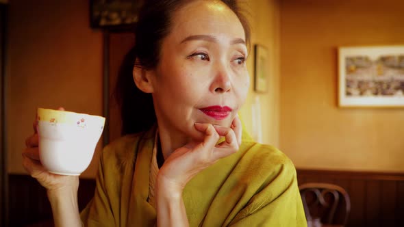 Elegant Japanese woman enjoying a coffee